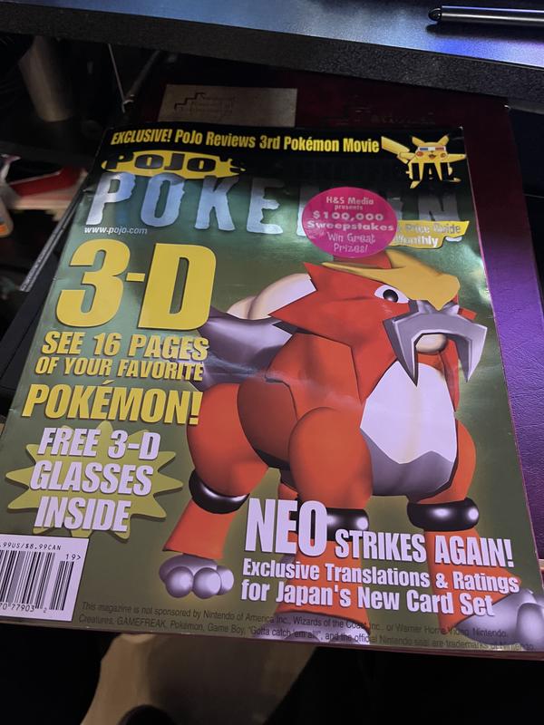 A copy of Pojo's Unofficial Pokémon News & Price Guide Monthly magazine, featuring Jon’s 3D model of Entei on the front cover