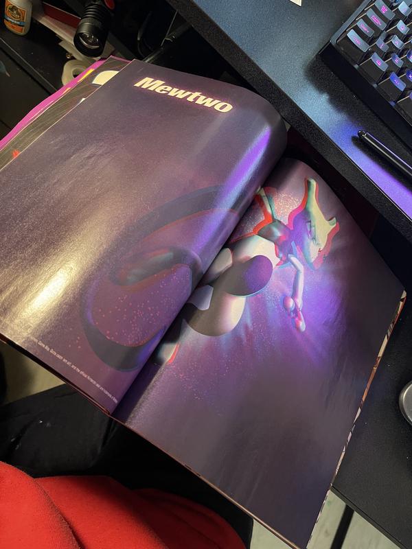 A photograph of Jon’s copy of Pojo magazine, featuring his 3D model of Mewtwo