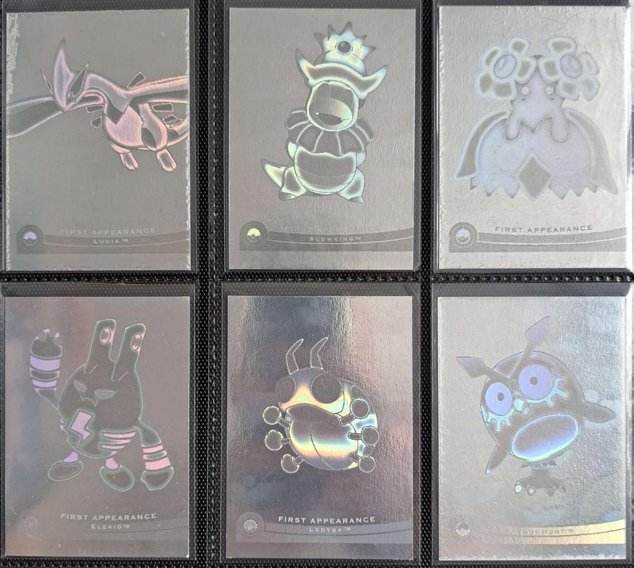 Topps Movie 2000 First Appearance cards, featuring Lugia, Slowking, Bellossom, Elekid, Ledyba and Hoothoot