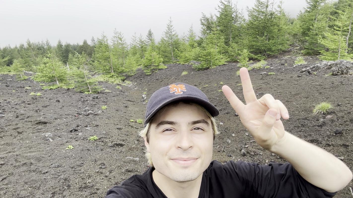 A photograph of Connor on top of Mt. Fuji, the real-life location of Mt. Silver in Johto