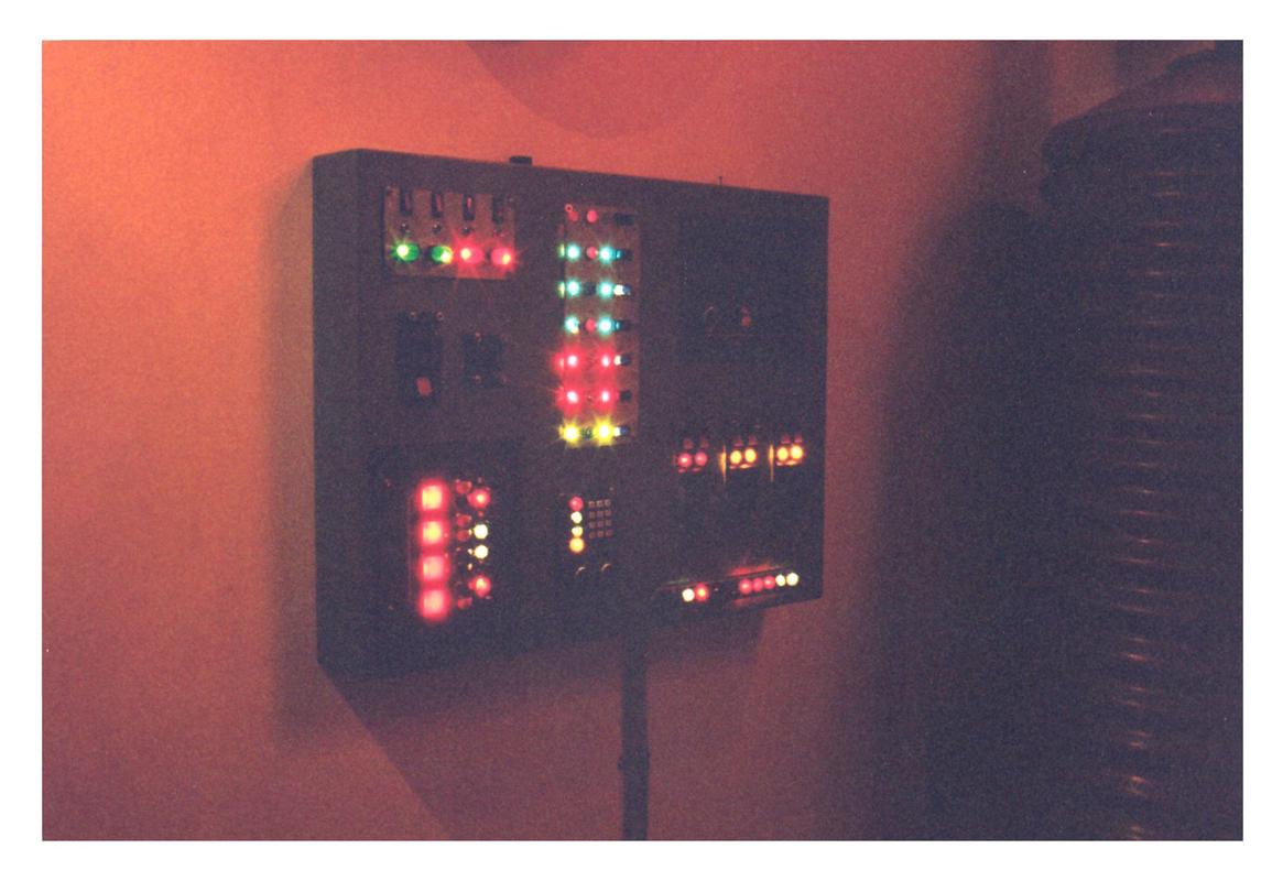 A control panel from the set with lots of different lights