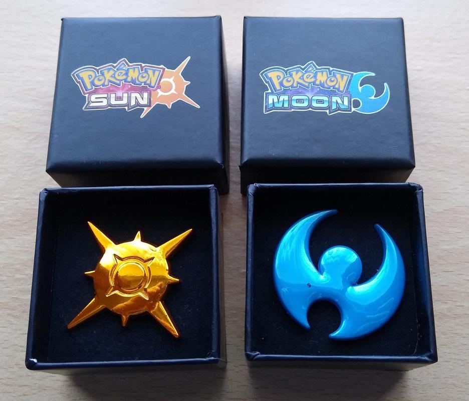 A friend of mine gave me these Pokémon Sun & Moon pin badges, but they were originally a pre-order bonus