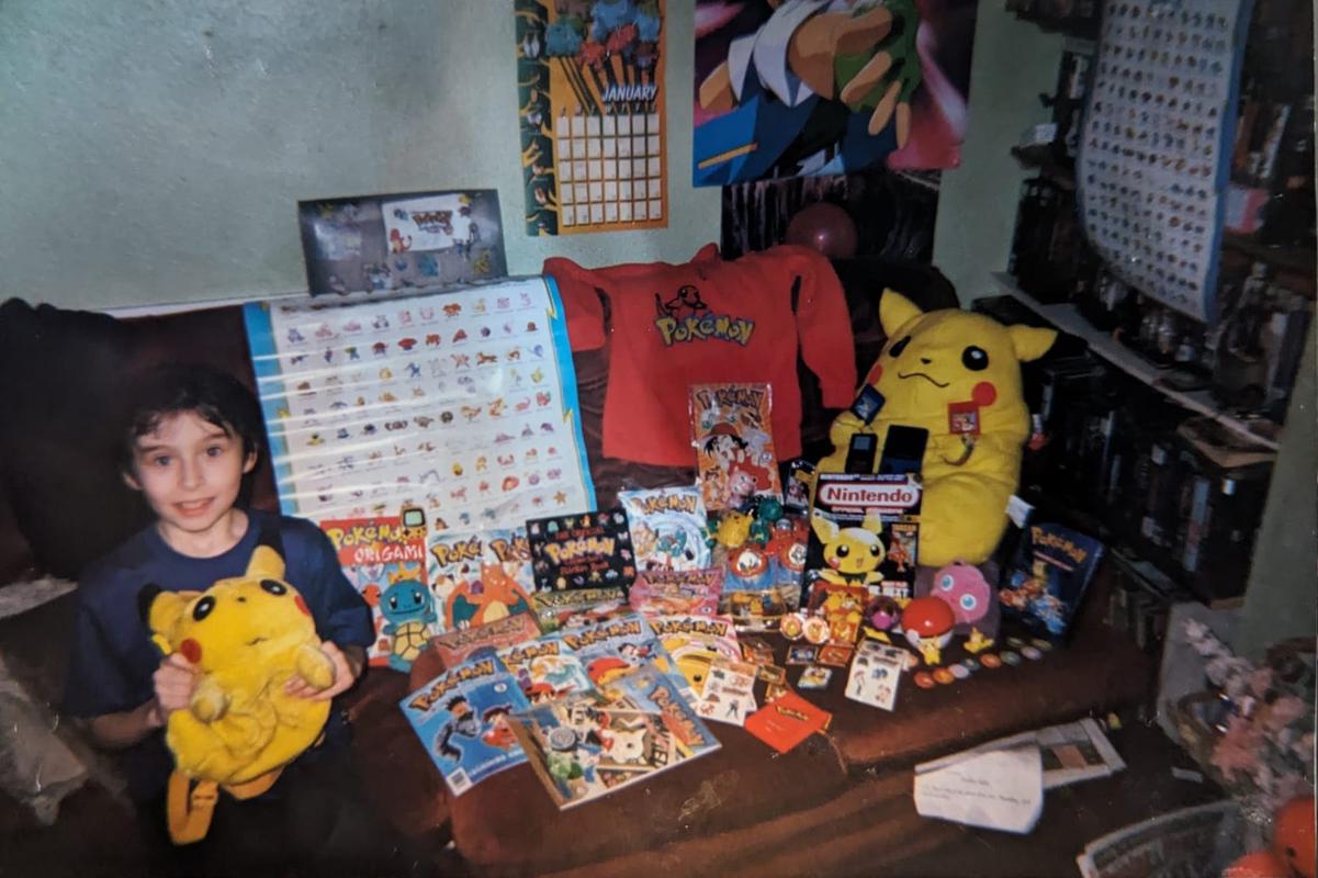 A photograph of Dazz holding a Pikachu backpack, and another view of his collection of Pokémon memorabilia. I wonder how much he still has today?