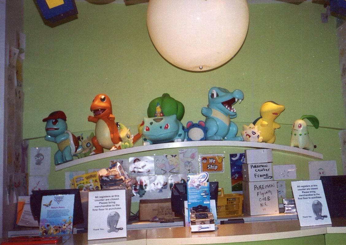 A photograph of one of the checkouts in the Pokémon Center New York, featuring a selection of starter Pokémon from the series