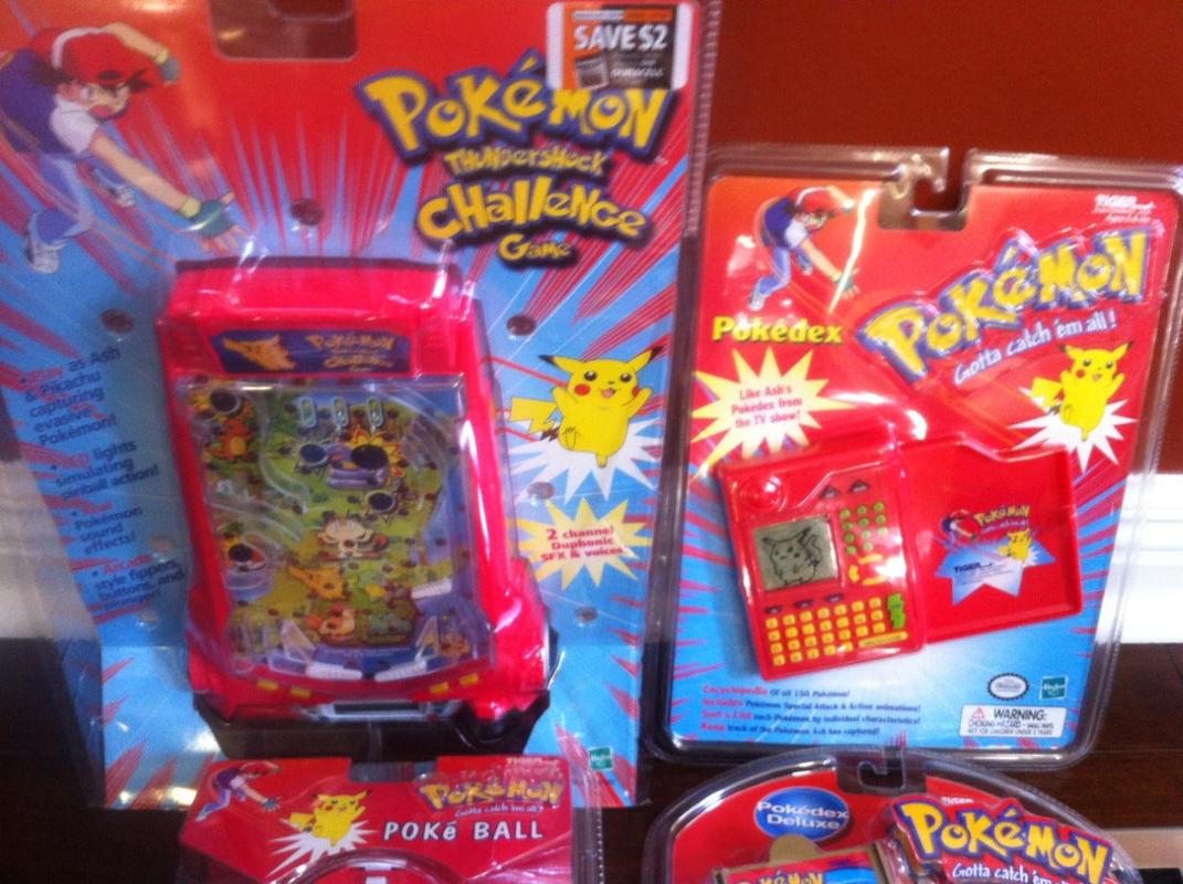 A selection of Pokémon products Chris worked on, which includes the Pokémon Thundershock Challenge Game and the Pokédex