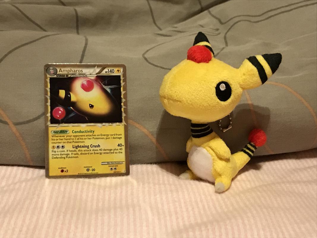 Ampharos is one of Sheep's favourite Pokémon! Here is her Ampharos card from the HeartGold & SoulSilver set that she pulled quickly without expecting it, along with a cute Ampharos plush that a close friend sent her, which has a lot of sentimental value