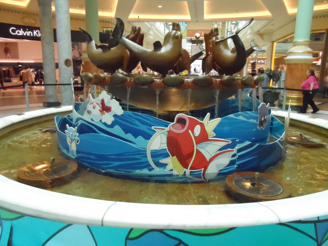 Another photograph of the fountain, taken from the ground floor, and featuring artwork of Horsea, Goldeen, Magikarp, and Shellder