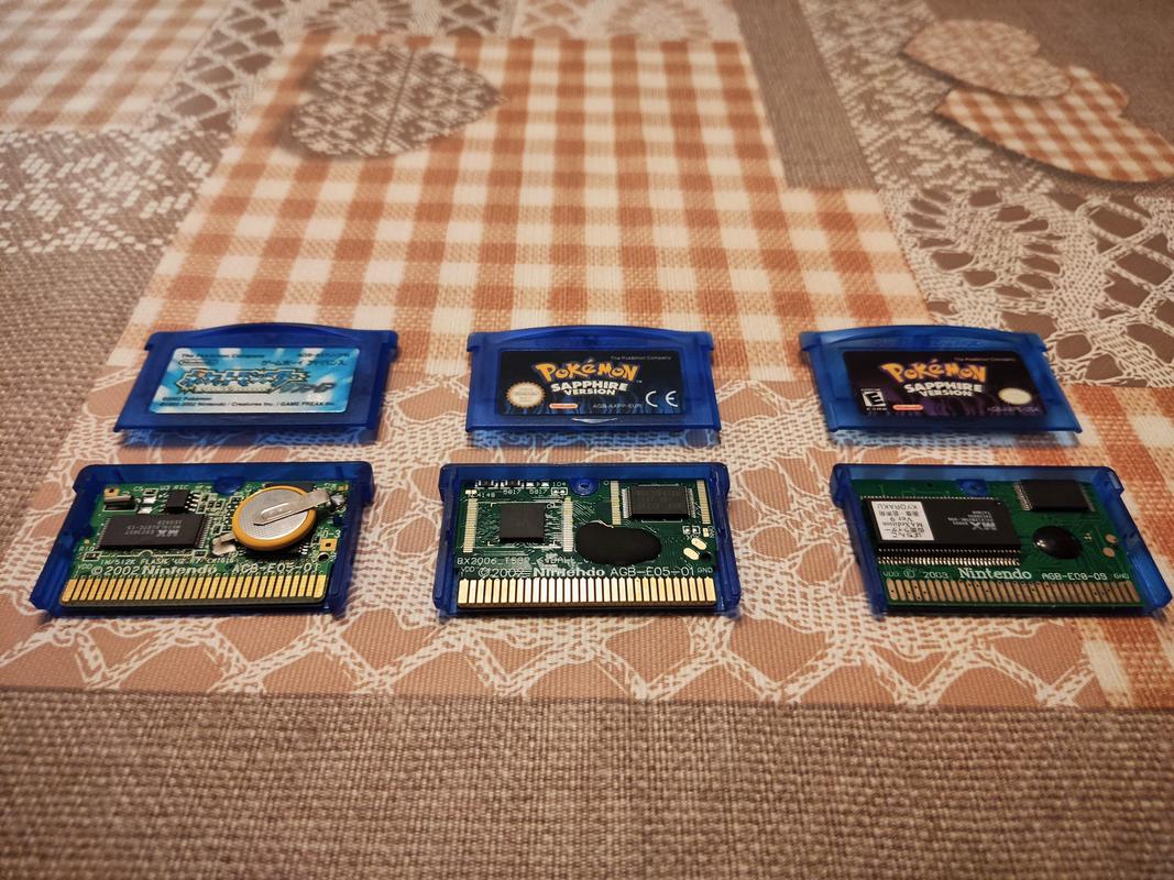 Copies of Pokémon Sapphire. Left side is a genuine Japanese copy, centre is a reproduction, right side is also a reproduction (Photo credit: Lucent)