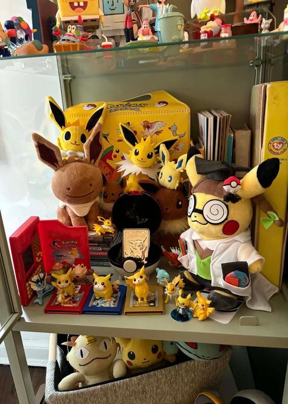 Steph's collection of Pokémon items today, containing plenty of Jolteon, Pikachu, and Eevee merchandise, including some toys from the late 90s, and her original Game Boy games