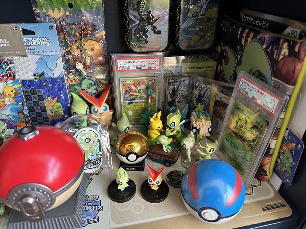 More items from Joe's collection of items include Pokémon cards, figures, and Poké Balls, including a special GS Ball