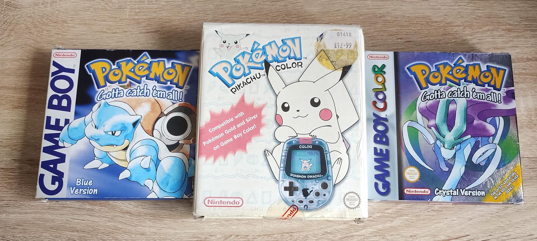 My copies of Pokémon Blue and Pokémon Crystal, with my Pocket Pikachu Color. I feel like this was the peak of my enjoyment of the Pokémon franchise.