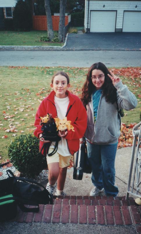 A photograph of Steph holding a Pikachu and Jolteon plush with her friend Ally, from Halloween 2000