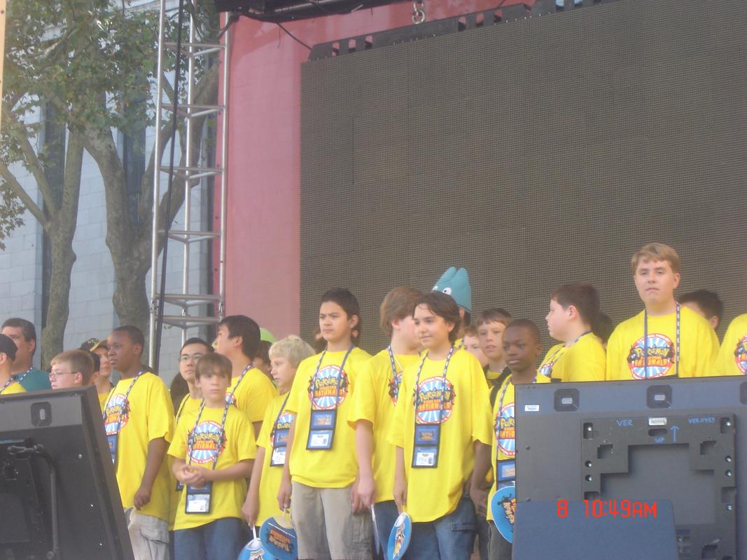 The finalists from the Pokémon 10th Anniversary Journey Across America events, on stage at Party of the Decade (Peter is wearing the Munchlax hat in the back)