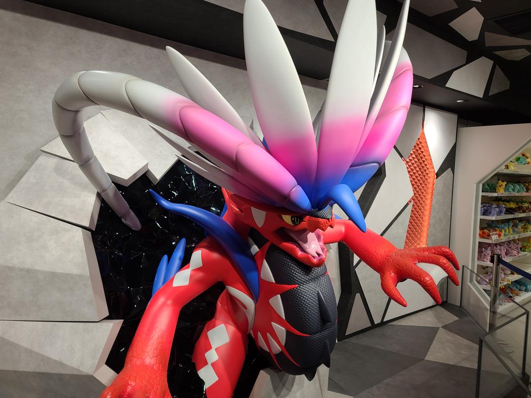 This impressive Koraidon statue looks like it’s jumping right out of the wall in the Osaka Pokémon Center store