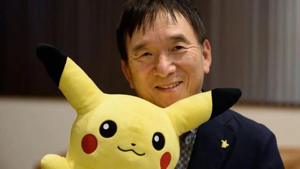 Tsunekazu Ishihara has been CEO of The Pokémon Company since 1998 and produced many Pokémon titles, initiating the Pokémon Trading Card Game and being responsible for the licensing of many other Pokémon products and toys